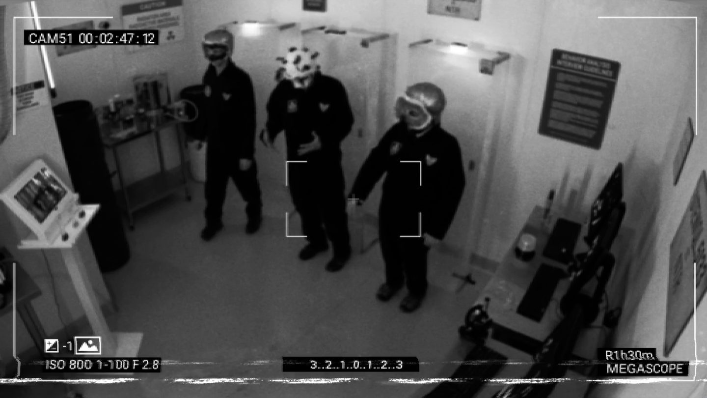 Security camera: three masked specimens in the lab