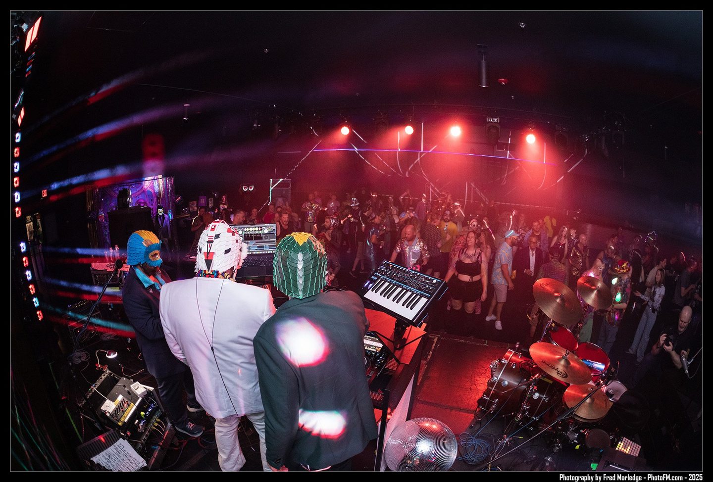 From behind the band